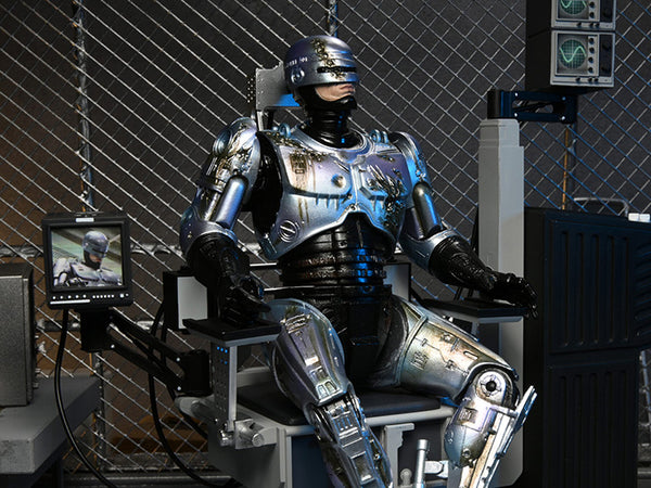 ROBOCOP - ULTIMATE BATTLE DAMAGED ROBOCOP WITH CHAIR ACTION FIGURE BY NECA